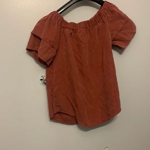 This top is burgundy and is from H&M and short sleeve